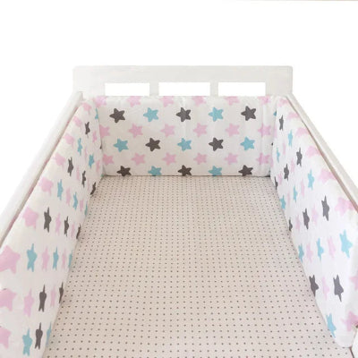 Réducteur de lit bébé étoiles roses et turquoises