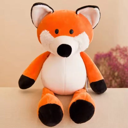 Animaux en peluches deux compagnons petit renars souriant asis