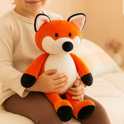 Animaux en peluches renard roux assis avec bebe 