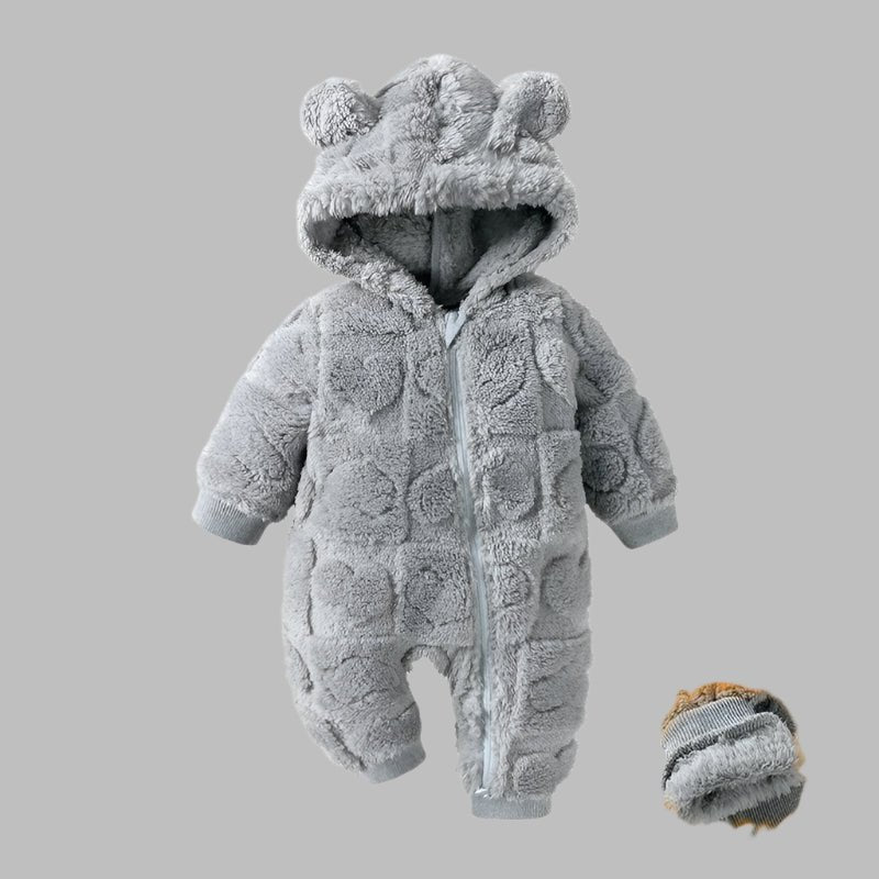 Pyjama Polaire Bébé Moelleux - Confort Optimal
Une barboteuse bébé garçon à fermeture éclaire 