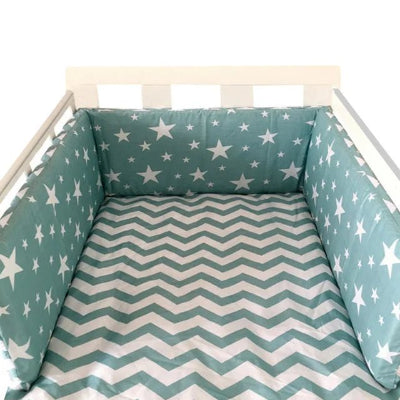Réducteur de lit bébé turquoise étoiles blanches  