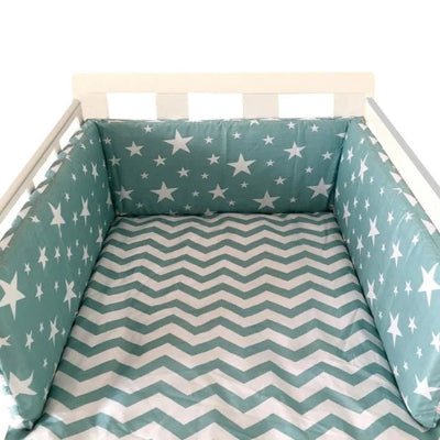 Réducteur de lit bébé turquoise étoiles blanches  