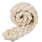 tresse de lit bebe beige enroullee en boule