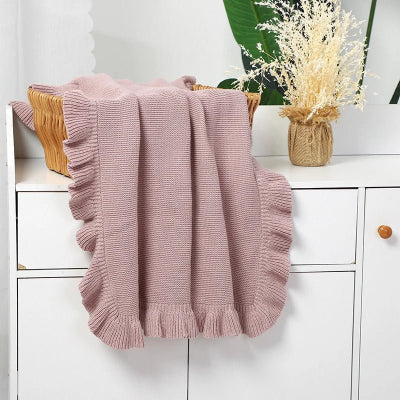 couverture en coton dans un panier