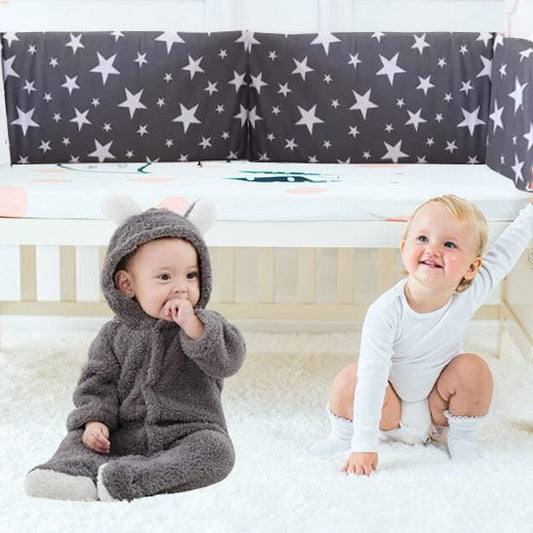 Réducteur de lit bébé heureux