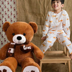 Ourson Peluche Gros Compagnon - Doudou Géant
ourson en peluche bruin et enfant 