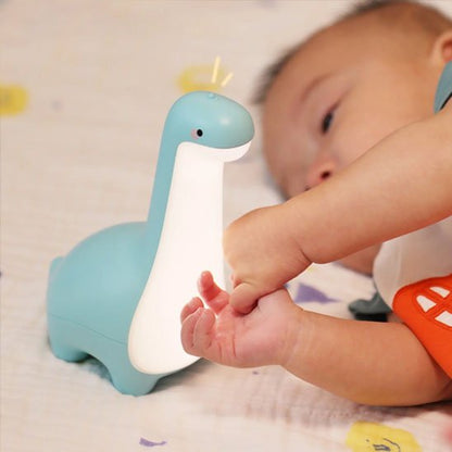 veilleuse dinosaure touche la veilleuse